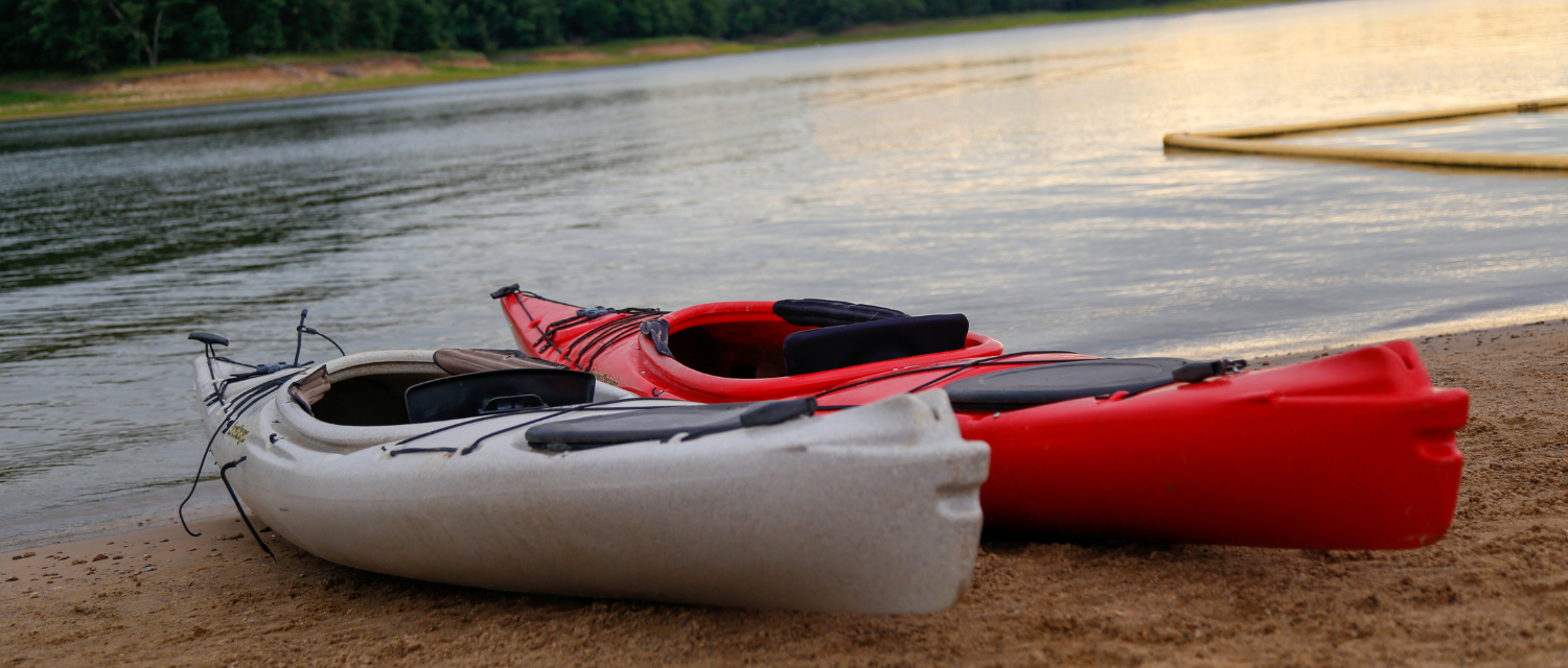 Boats on the shore of Rathbun Lake at Honey Creek Resort